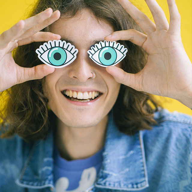 Man holding cartoon eyes